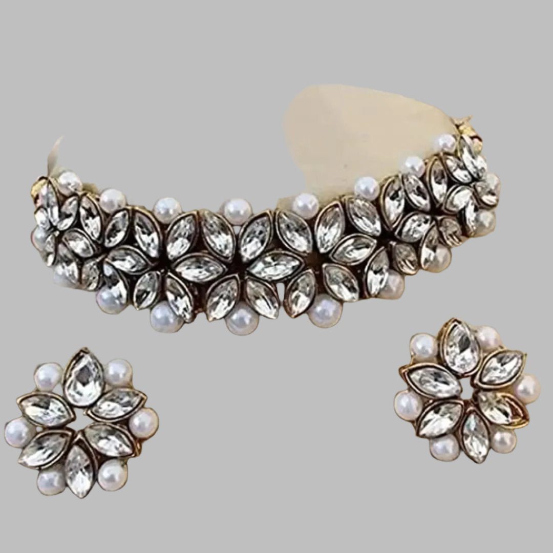 Beautiful Alloy Choker set for women
Color:  White and gold
Material: Alloy
Country of Origin: INDIA
Enhance your style with our Beautiful Alloy Choker set for women. Made with high-quality alloy, it is perfect for adding a touch of elegance to any outfit. The sleek design and durability make it a must-have accessory for any fashion-forward woman. Embrace your beauty with this stunning choker set.